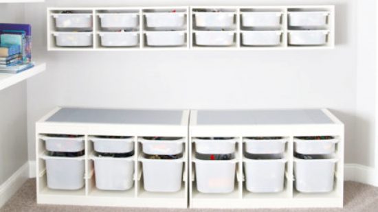 Best Lego tables guide - marketing photo showing the IKEA hack storage table in white, with plastic bins