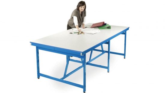 Best Lego tables guide - marketing photo showing the monarch project table in white and blue, with a woman arranging folders on the tabletop