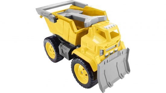 Best Matchbox cars, marketing photograph by Mattel - a chunky yellow toy dumptruck with a child's toy spade in the hopper