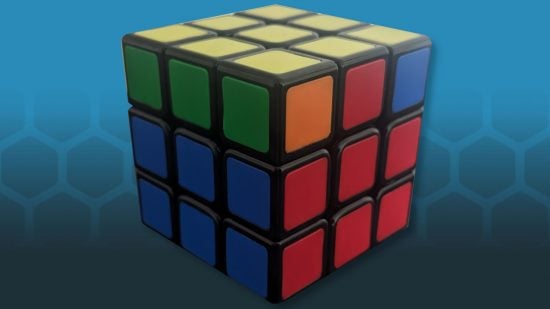 How to solve a Rubiks Cube - photo of a Rubik's Cube with the green top row solved on the left face