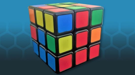 How to solve a Rubiks Cube - photo of a Rubik's cube with a red upside-down T shape on the front face