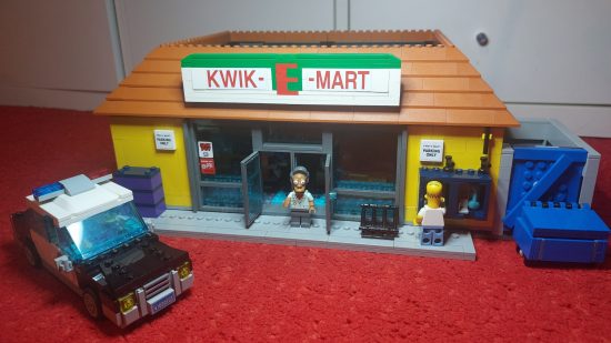 Lego Simpsons Kwik-E-Mart review image showing the constructed shop, alongside the police car, from the front.