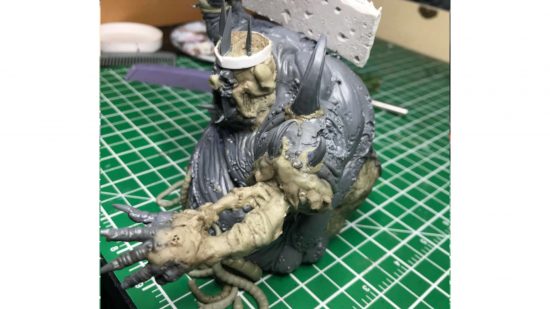 Warhammer Nurgle Great Unclean One converted into the Swine Prince from Darkest Dungeon, a bloated,, legless, pig-faced monster with a cleaver, its left arm reduced to bone