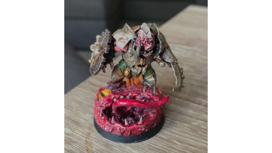 Warhammer Orruk brute converted into a Darkest Dungeon Swine - a pig-faced brute with vicious blades and bulky, rusted armor