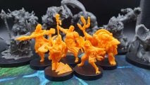 Bardsung review - a party of yellow plastic heroes surrounded by monsters