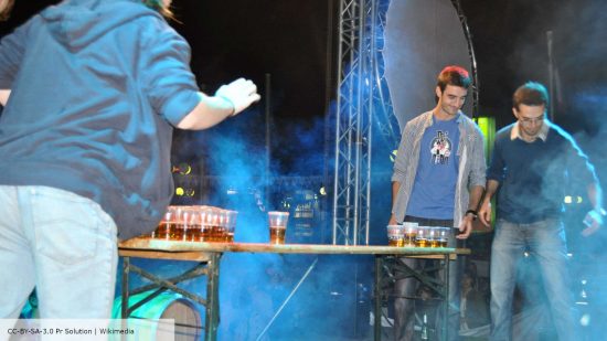 Beer Pong Rules - a game of beer pong at Beer Fest Kosova - photo by Pr Solution, hosted on Wikimedia CC-BY-SA-3.0