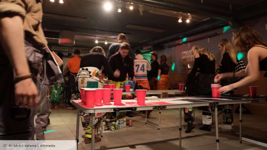Beer Pong rules - students play Beer Pong at Lappeenranta University, photo by Kallerna, hosted on Wikimedia CC-BY-SA-4.0