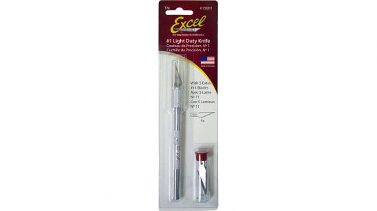 Best hobby knife - excel light duty knife, a silver hobby knife in a cardboard packet, with spare knives in a small pot