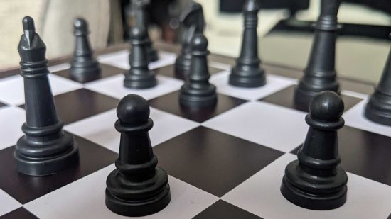 Chess strategies - photo of black chess pieces on a chessboard