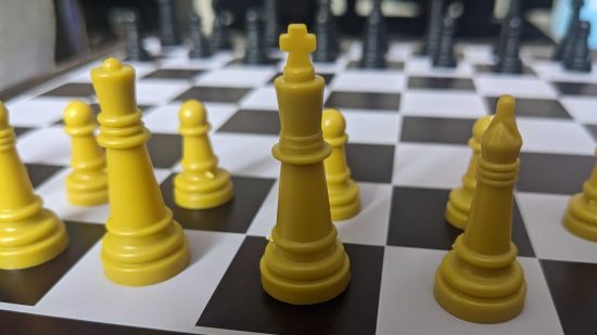 Chess strategies - photo of a chessboard, with the white king at the centre of the image
