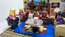 Lego Big Bang Theory review image showing all the characters in their living room in a Lego recreation of the show's opening scene.