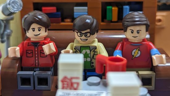 Lego Big Bang Theory review image showing Howard, Leonard, and Sheldon on their Lego sofa.