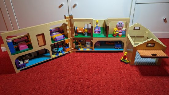 Lego Simpsons House review image, showing the contructed house wide open with all the figures in it and the rooms visible.