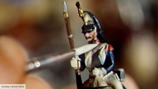 Star Wars Peter Cushing was a miniature wargamer - screenshot from British Pathé video about Peter Cushing, showing a close up of a fine tip brush painting a napoleonic miniature