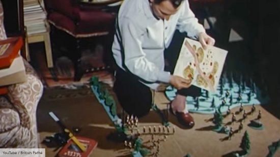 Star Wars Peter Cushing was a miniature wargamer - screenshot from British Pathé video about Peter Cushing, showing him setting up the battlefield on the floor