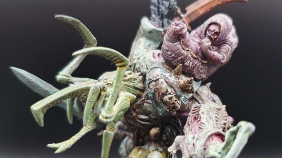 Warhammer 40k Daemons daemon prince - a grublike entity wirding on a huge, insectoid manthing