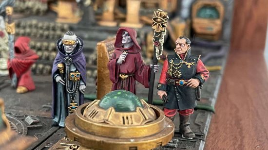 Closeup of Daniel McGirr's first Warhammer 40k Golden Throne Diorama - three Imperial advisors gather by a hololithic table in the presence of the Emperor