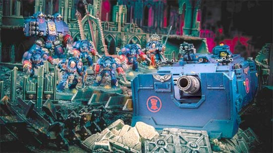 Warhammer 40k Space Marines guide - Games Workshop photo showing a force of painted Crimson Fists Space Marines models including Terminators and a Vindicator tank