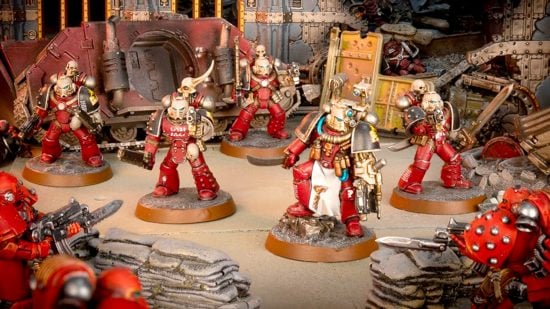 Warhammer 40k Word Bearers guide - Games Workshop photo showing a unit of traitor Word Bearers 30k space marines during the Horus Heresy, including an Apothecary, fighting 30k loyalist Blood Angels
