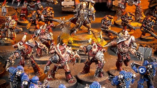 Warhammer 40k Word Bearers guide - Games Workshop image showing a tabletop force of Horus Heresy Word Bearers fighting 30k Ultramarines models