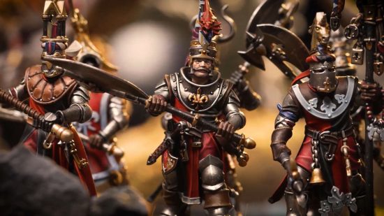 Warhammer The Old World bretonnian footknights - closeup of heavily armed and armored knights in ornate armor