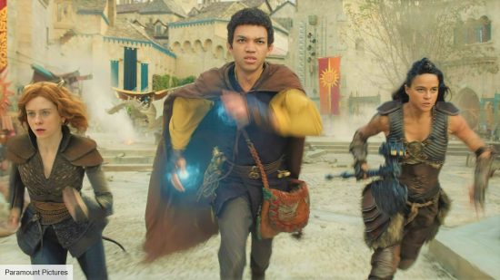 Three adventurers running towards the camera in DnD Honor Among Thieves, one of the best board game movies