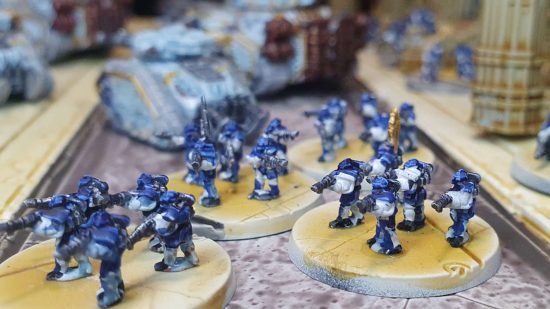 Legions Imperialis review - Solar Auxilia infantry cross a street