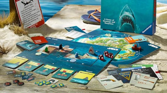 Movie board games - The jaws board game surrounded by pieces, the box, and scenery