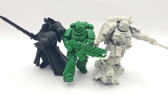 Painting Space Marines - three models primed in black, green, and white