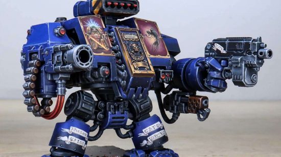 A model painted by pro Warhammer painting service Siege Studios - converted ultramarines dreadnought holding a handgun