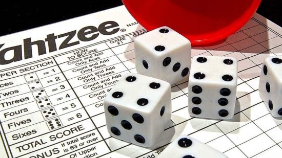 Dice on a points sheet from Yahtzee, one of the best Roll and Write games