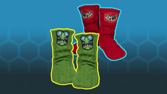 Warhammer 40k Christmas socks - a green set of socks with a goblin face, a red pair of socks with a massive 'squig' grin