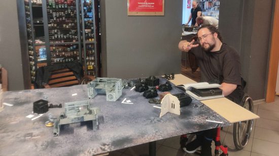 Warhammer 40k fan and wheelchair user Filip plays a game in a local game store