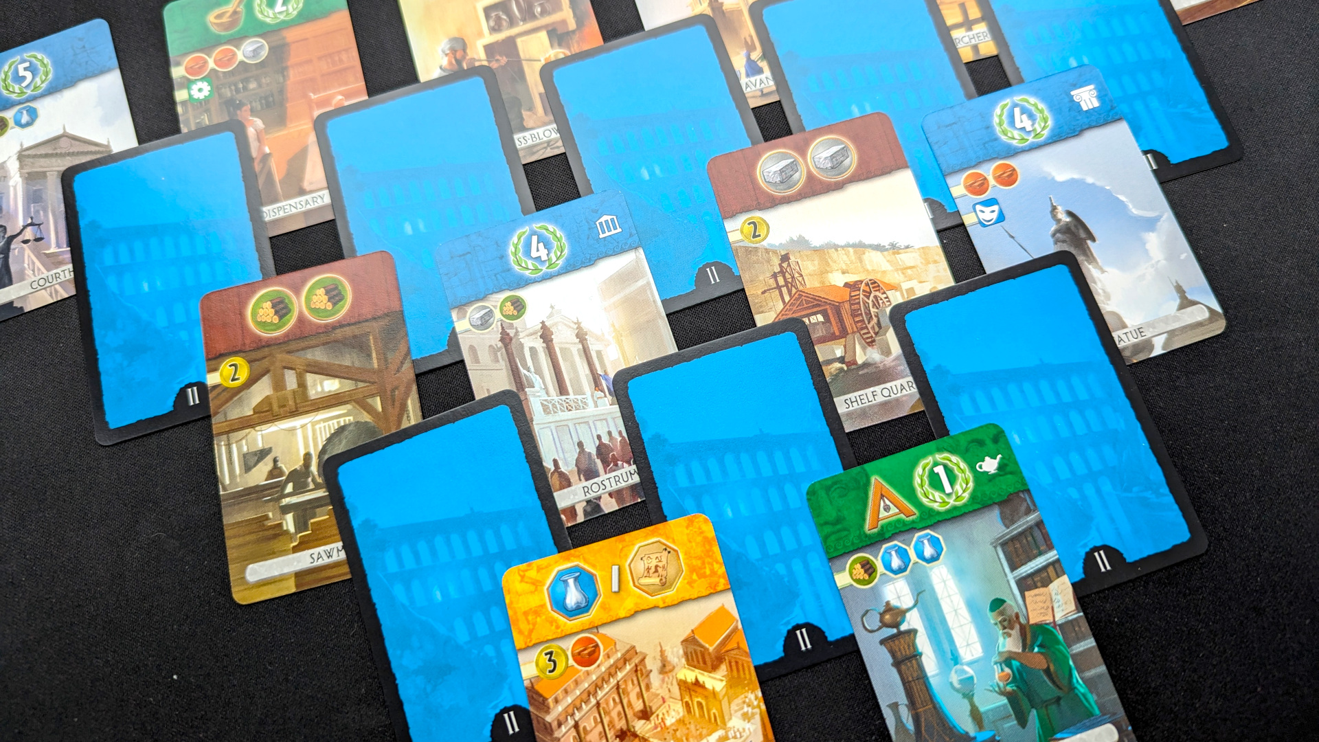 7 Wonders Duel review - author photo showing the game's cards "Structure" laid out on a table