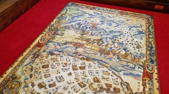 Best board games for couples guide - Frosthaven photo taken by Wargamer showing the game map board on a red tabletop