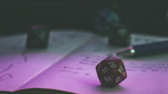 How science proved DnD doesn't harm your kids - stock image of a notebook with DnD dice