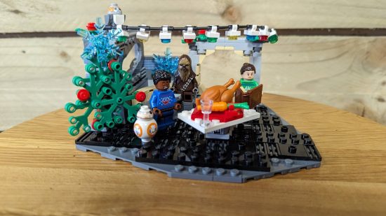 Lego Millennium Falcon Holiday Diorama review image showing the completed set with all the characters gathered around the dinner table.