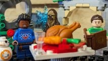 Lego Millennium Falcon Holiday Diorama review image showing the Star Wars characters standing around a festive Turkey.