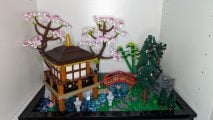 The Lego Tranquil Garden set on a white bookcase
