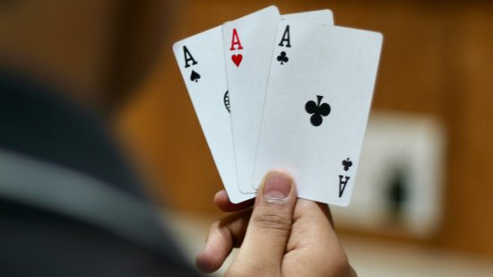 Playing card games - a hand with three ace cards