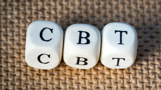 Losing at Warhammer 40k - stock photo showing three dice marked with the letters CBT, standing for Cognitive Behavioral Therapy