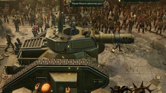 Warhammer 40k Rogue Trader review - author screenshot showing the rogue Trader riding in the cupola of a Leman Russ battle tank during a parade with crowds