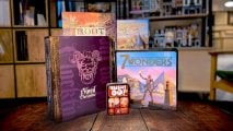 Best board games guide - Wargamer photo showing several board game boxes on a table at the Network N office, including Blood on the Clocktower, 7 Wonders, Sushi Go, Root, and Carcassonne - with Lego in the background