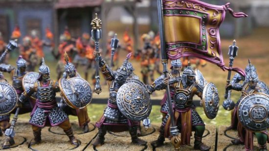 Warhammer-like wargame Conquest Sorcerer Kings Rajakhur elite infantry, ranks of warriors with shields, wearing medieval Indian armor