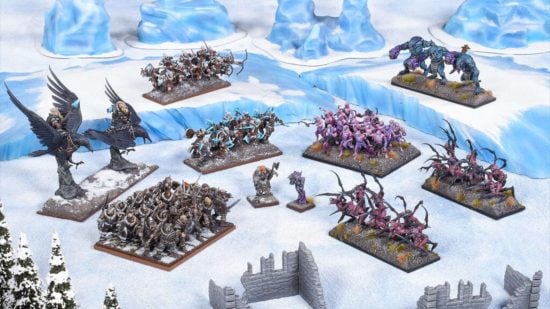Fantasy wargames - a Kings of War starter set, with forces of norse human warriors, supported by giant ravens, face off against living nightmares