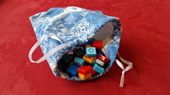 How to play Azul - photos of Azul tiles inside a bag