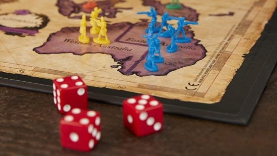 How to play Risk - photo of Risk board game, miniatures, and dice