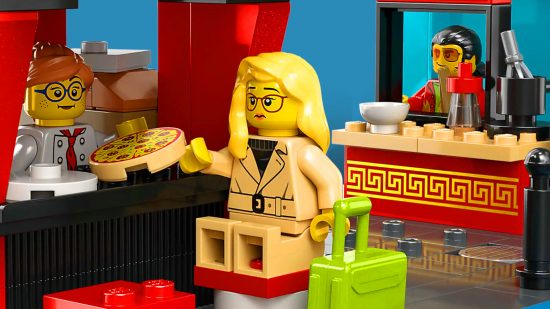 Female minifig from a Lego City set ordering pizza
