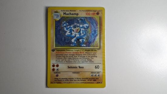Shadowless pokemon cards - a shadowed Machamp card with a first edition icon
