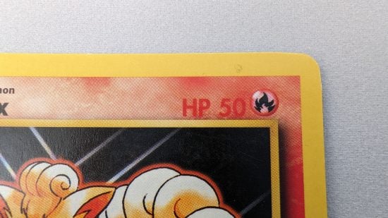 Shadowless Pokemon cards - detail of the HP text on a regular pokemon card, which has thicker, more heavily inked font